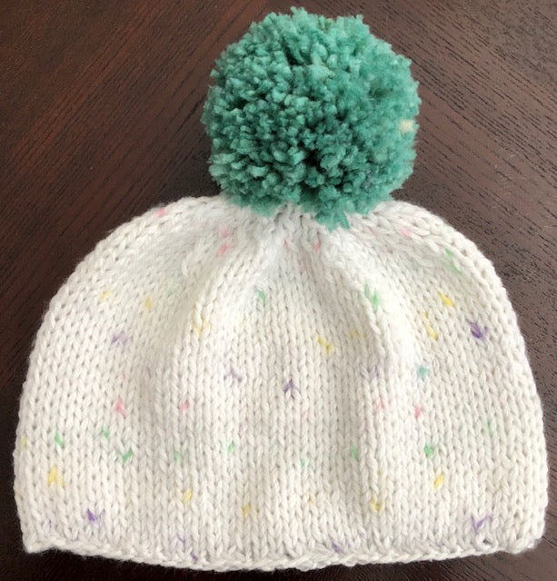 Light weight white speckled hat, super soft with green pom pom