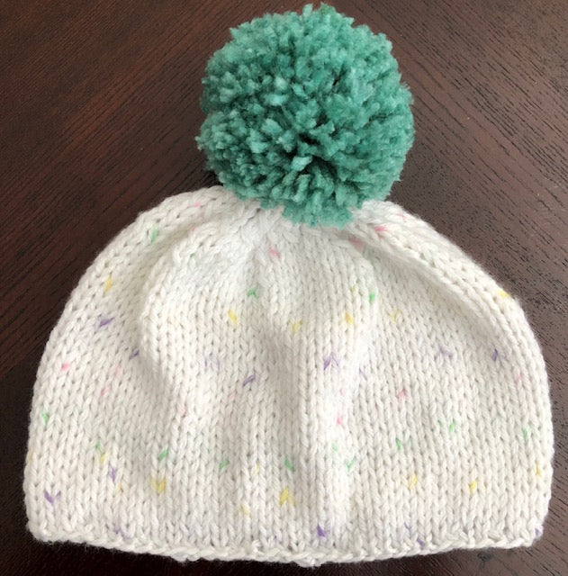 Light weight white speckled hat, super soft with green pom pom